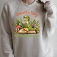 Unearth A Story Summer Reading 2026 Dinosaur Reading Books Raglan Sleeve Sweatshirt Heather Forest Unearth A Story Summer Reading 2026 Dinosaur Reading Books Raglan Sleeve Sweatshirt Heather Forest