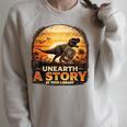 Unearth Story Summer Reading 2026 Dinosaurs Library Reading Raglan Sleeve Sweatshirt Heather Forest