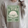 Unearth a Story Summer Reading 2026 Palaeontologists Book Raglan Sleeve Sweatshirt Heather Forest