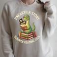 Unreath a Story Summer Library Reading 2026 Dinosaur Book Raglan Sleeve Sweatshirt Heather Forest
