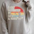 Vintage Retro Easily Distracted By Cats And Books Raglan Sleeve Sweatshirt Heather Forest