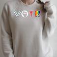 Vote Books Fist Ovaries LGTBQ Men Women Raglan Sleeve Sweatshirt Heather Forest