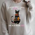 A Woman Cannot Survive On Books Alone She Also Needs CAT Raglan Sleeve Sweatshirt Heather Forest