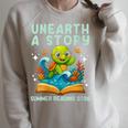 Women's Book Sea Turtle Summer Reading 2026 Unearth a Story Raglan Sleeve Sweatshirt Heather Forest Women's Book Sea Turtle Summer Reading 2026 Unearth a Story Raglan Sleeve Sweatshirt Heather Forest