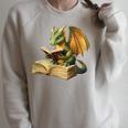 Women's Dragon Bookworm Reading Book Graphic Raglan Sleeve Sweatshirt Heather Forest Women's Dragon Bookworm Reading Book Graphic Raglan Sleeve Sweatshirt Heather Forest