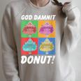 Women's Dungeon Crawler Carl God Damnit Donut Cat Pop Art Book Raglan Sleeve Sweatshirt Heather Forest Women's Dungeon Crawler Carl God Damnit Donut Cat Pop Art Book Raglan Sleeve Sweatshirt Heather Forest