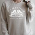 Women's First Edition Published 2025 The Littlest Book Club Member Raglan Sleeve Sweatshirt Heather Forest