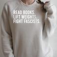 Women's Read Books Lift Weights Fight Fascists Reading Activism Raglan Sleeve Sweatshirt Heather Forest Women's Read Books Lift Weights Fight Fascists Reading Activism Raglan Sleeve Sweatshirt Heather Forest
