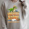 Women's Unearth a Story Dinosaur Reading Books Summer 2026 Raglan Sleeve Sweatshirt Heather Forest