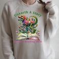 Women's Unearth A Story Summer Reading 2026 Dinosaur Book Floral Raglan Sleeve Sweatshirt Heather Forest
