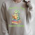 Women's Unearth a Story Triceratops Dinosaur Reading Books Cute Dino Raglan Sleeve Sweatshirt Heather Forest