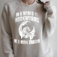 In A World Of Bookworms Be A Book Dragon Inspirational Raglan Sleeve Sweatshirt Heather Forest In A World Of Bookworms Be A Book Dragon Inspirational Raglan Sleeve Sweatshirt Heather Forest