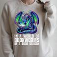 In a World Of Bookworms Be a Book Dragon Reading Raglan Sleeve Sweatshirt Heather Forest In a World Of Bookworms Be a Book Dragon Reading Raglan Sleeve Sweatshirt Heather Forest