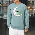Astronaut And Alien Reading On Moon Space Book Lover Sci Fi Raglan Sleeve Sweatshirt Cardinal