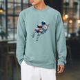 Astronaut Reading Book Sci-Fi Enthusiast Raglan Sleeve Sweatshirt Cardinal