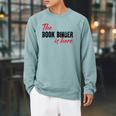 The Book Binder Is Here Raglan Sleeve Sweatshirt Cardinal