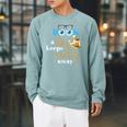A Book A Day Keeps Reality Away Keep Your Day Dream Raglan Sleeve Sweatshirt Cardinal
