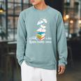 A Book A Day Keeps Reality Away Literature Reading Raglan Sleeve Sweatshirt Cardinal