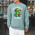 Books Never Go Extinct Reading Dinosaur Bookish Nerdy Raglan Sleeve Sweatshirt Cardinal