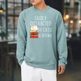 Easily Distracted By Cats And Books Cute Book Lover Raglan Sleeve Sweatshirt Cardinal