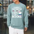Easily Distracted By Cats And Books Cute Cat And Book Lovers Raglan Sleeve Sweatshirt Cardinal