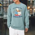 I Still Read Children’s Books Cute Duck Reading Book Lover Raglan Sleeve Sweatshirt Cardinal