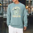 Skeleton I Buy Books Like I'm Immortal Halloween Raglan Sleeve Sweatshirt Cardinal