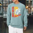 Skeleton Reads a Book Anti Social Book Club Raglan Sleeve Sweatshirt Cardinal