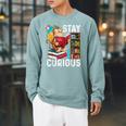 Stay Curious Monkey Reading Book Lover Bookworm Raglan Sleeve Sweatshirt Cardinal