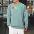 Teacher Reading Read In Color Book Raglan Sleeve Sweatshirt Cardinal