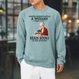 Never Underestimate A Woman Who Still Reads Books In Her Raglan Sleeve Sweatshirt Cardinal