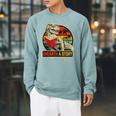Unearth a Story Dinosaur Reading Book Dino T Rex Summer 2026 Raglan Sleeve Sweatshirt Cardinal
