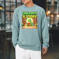 Unearth A Story Dinosaur Summer Reading 2026 Books Raglan Sleeve Sweatshirt Cardinal