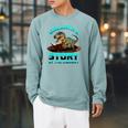 Unearth A Story At The Library Dinosaur Reading Raglan Sleeve Sweatshirt Cardinal
