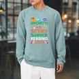 Unearth A Story Summer Reading Program 2026 Dinosaur Book Raglan Sleeve Sweatshirt Cardinal