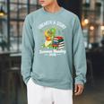 Unearth a Story Triceratops Dinosaur Reading Books Cute Dino Premium Tri-Blend Raglan Sleeve Sweatshirt Cardinal