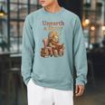 Women's Unearth a Story Triceratops Dinosaur Reading Books Dino Raglan Sleeve Sweatshirt Cardinal