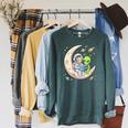 Women's Astronaut Reading Book With Alien Moon Space Astronomy Raglan Sleeve Sweatshirt Heather Blue Lagoon