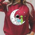 Astronaut And Alien Reading On Moon Space Book Lover Sci Fi Raglan Sleeve Sweatshirt Heather Dust