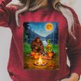 Bigfoot And Alien Reading Books Campfire Halloween Raglan Sleeve Sweatshirt Heather Dust