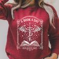 A Book A Day Keeps Reality Away Classic Fantasy Dragon Raglan Sleeve Sweatshirt Heather Dust