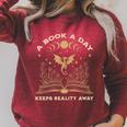 A Book a Day Keeps Reality Away Fantasy Book Lover Premium Tri-Blend Raglan Sleeve Sweatshirt Heather Dust