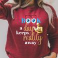 A Book A Day Keeps Reality Away Keep Your Day Dream Raglan Sleeve Sweatshirt Heather Dust