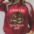 A Book A Day Keeps Reality Away Raglan Sleeve Sweatshirt Heather Dust