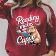 Book Lover Reading Makes Me Cappy Pun Capybara Reading Raglan Sleeve Sweatshirt Heather Dust