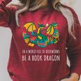 Book Lover In A World Full Of Bookworms Be A Book Dragon Raglan Sleeve Sweatshirt Heather Dust