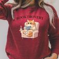 BOOKTROVERT Cute Cat With Tea Cozy Sweater And Book Raglan Sleeve Sweatshirt Heather Dust BOOKTROVERT Cute Cat With Tea Cozy Sweater And Book Raglan Sleeve Sweatshirt Heather Dust