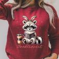 Booktrovert Raccoon Reading Book Iced Coffee Lover Raglan Sleeve Sweatshirt Heather Dust