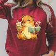 Capybara Reading a Book With Bubble Tea Raglan Sleeve Sweatshirt Heather Dust