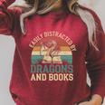 Easily Distracted By Books & Dragons Bookworm Reading Raglan Sleeve Sweatshirt Heather Dust Easily Distracted By Books & Dragons Bookworm Reading Raglan Sleeve Sweatshirt Heather Dust